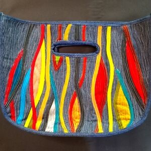 One of a kind hand held tote made with reclaimed denim and silks